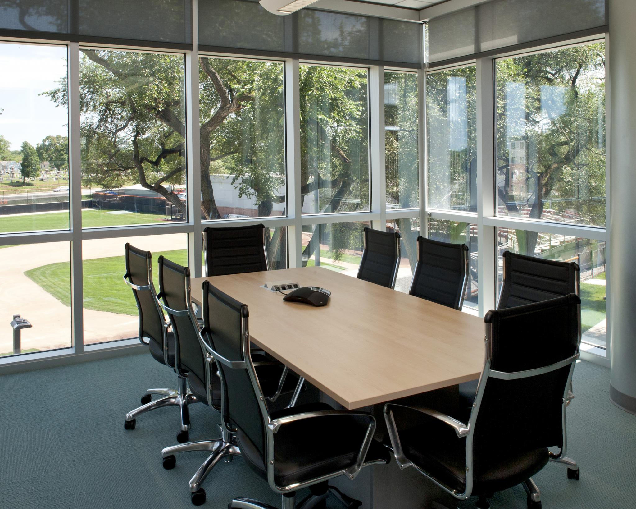 meeting room with windows and conference table