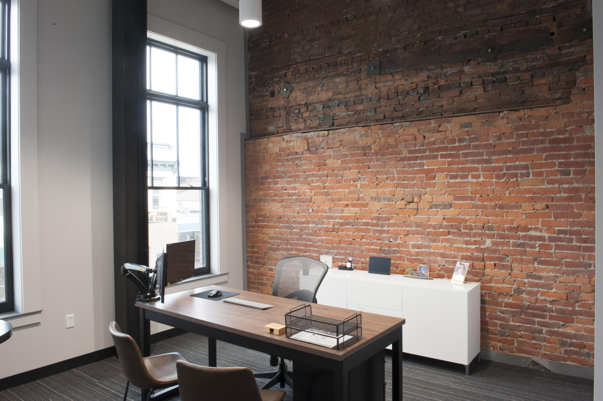 an image of an office with brick walls