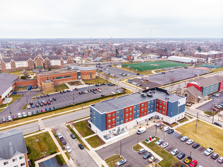 aerial image of apartment building and college campus