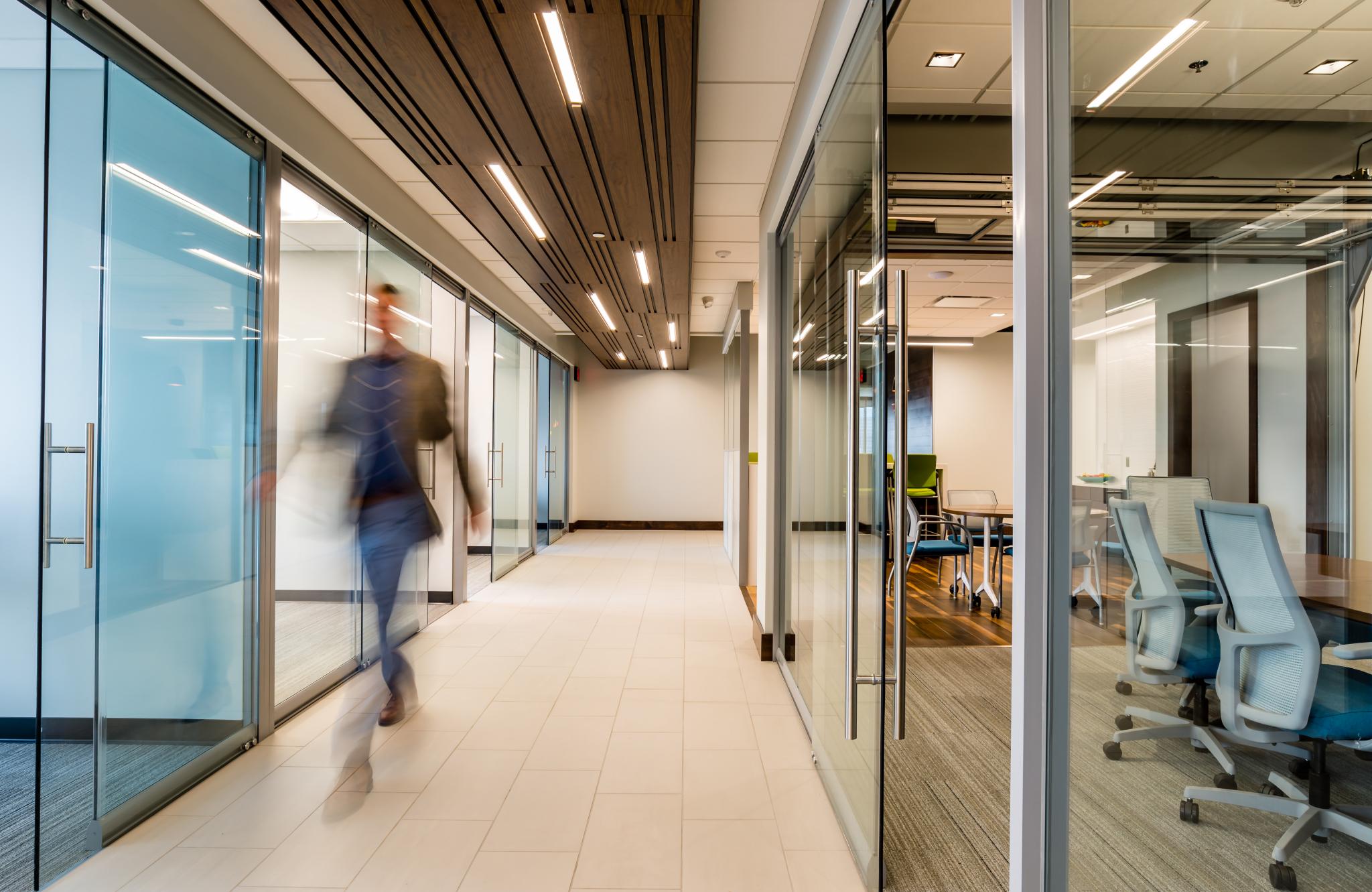 hallway with glass window walls