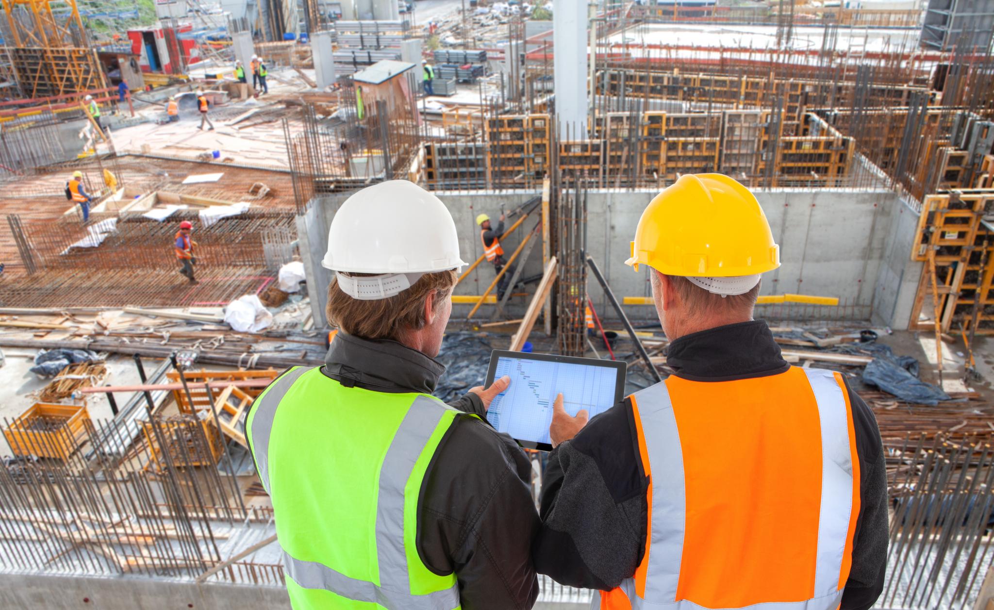 an image of construction and architecture personnel at an active construction site