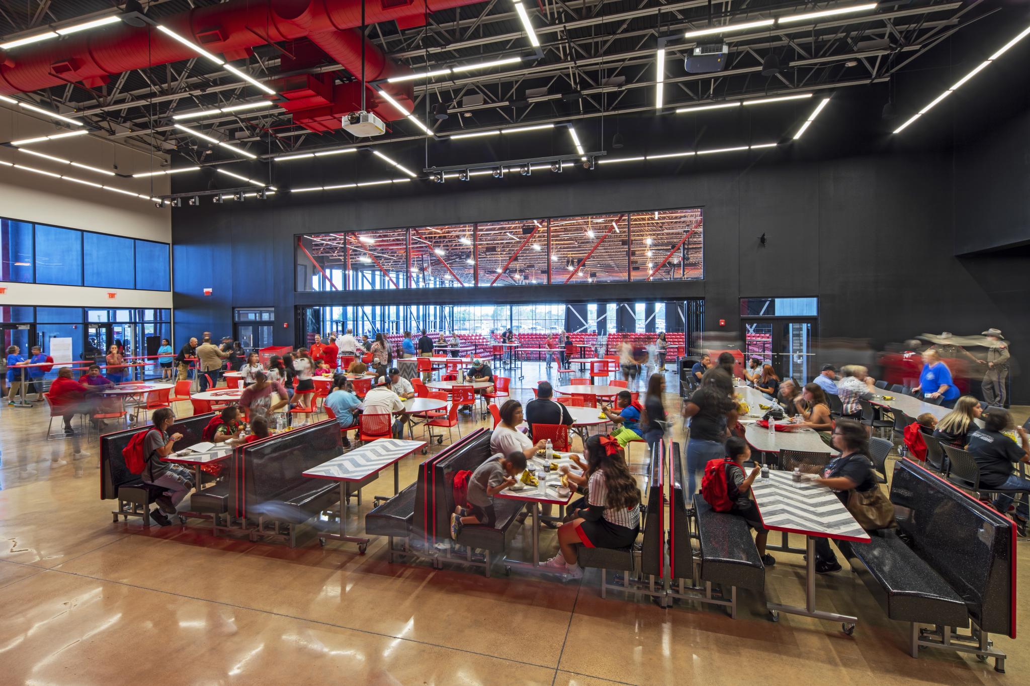 a cafeteria with people sitting in it